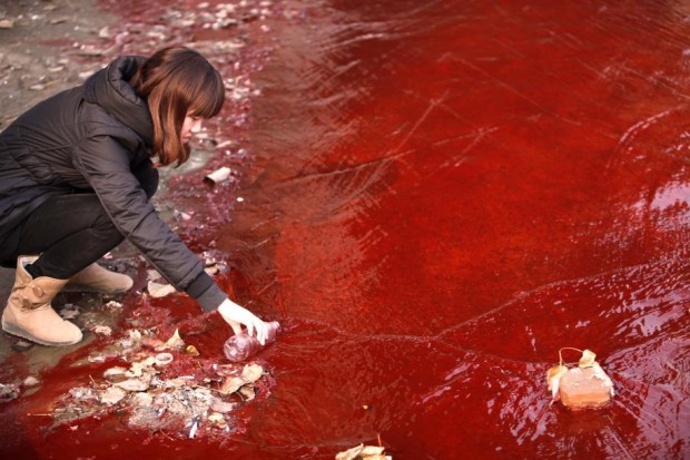 two-illegal-chemical-plants-that-were-discharging-their-production-waste-water-into-the-rain-sewer-pipes-allegedly-caused-the-jianhe-river-in-luoyang-henan-province-to-turn-red-in-december-2011
