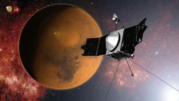 In this artist concept provided by NASA, the MAVEN spacecraft approaches Mars on a mission to study its upper atmosphere. When it arrives on Sunday Sept. 21, 2014, MAVEN's 442 million mile journey from Earth will culminate with a dramatic engine burn, pulling the spacecraft into an elliptical orbit. It's designed to circle the planet, not land. (AP Photo/NASA)