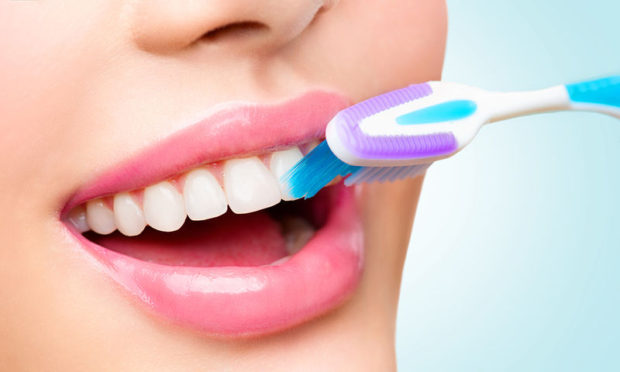 bigstock-Teeth-brushing-Beautiful-whit-136043996