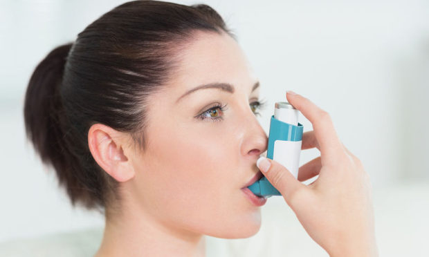 bigstock-woman-having-asthma-using-the-40893925