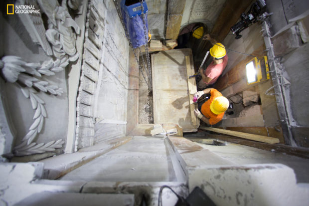 This Wednesday Oct. 26, 2016 shows the moment workers remove the top marble layer of the tomb said to be of Jesus Christ in the Church of Holy Sepulcher in Jerusalem. a restoration team has peeled away a marble layer for the first time in centuries in an effort to reach what it believes is the original rock surface where Jesus’ body was laid. Many historians have long believed that the original cave, identified a few centuries after Jesus’ death as his tomb, was obliterated ages ago. But an archaeologist accompanying the restoration team said ground penetrating radar tests determined that cave walls are in fact standing _ at a height of six feet and connected to bedrock _ behind the marbled panels of the chamber at the center of Jerusalem’s Church of the Holy Sepulchre. (Dusan Vranic/National Geographic via AP)