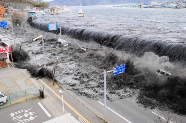 A wave approaches Miyako City from the Heigawa estuary in Iwate Prefecture after the magnitude 8.9 earthquake struck the area, March 11, 2011. REUTERS/Mainichi Shimbun